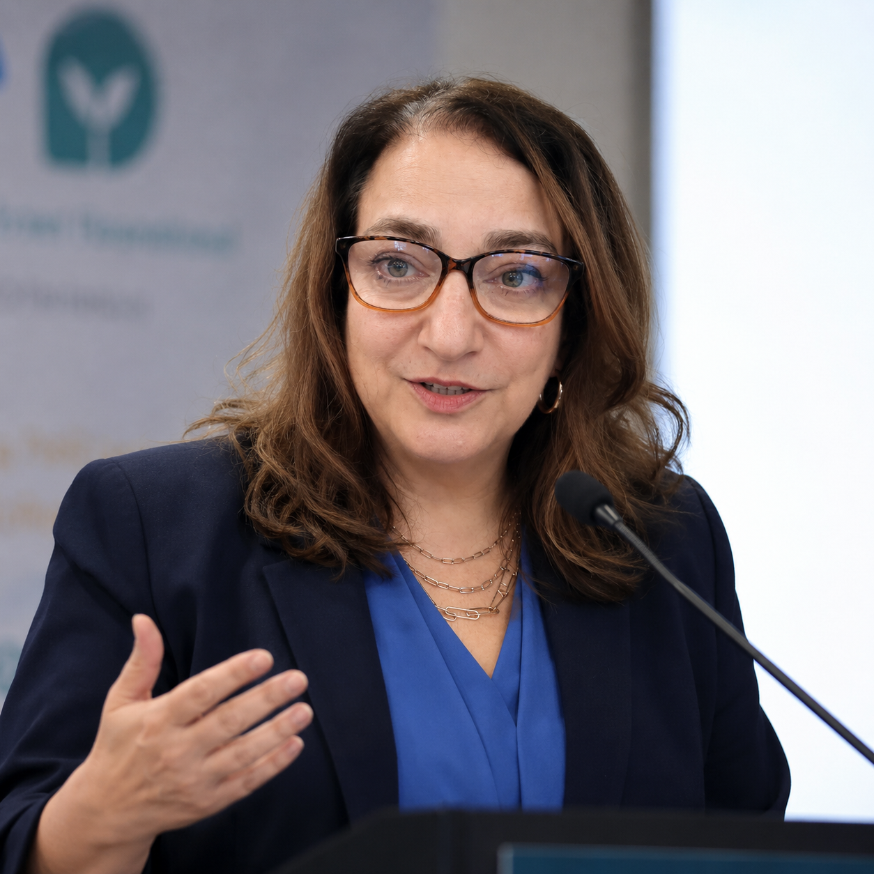 Gina Volynsky speaking at an event